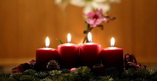 Lit, Red Candles in a table wreath