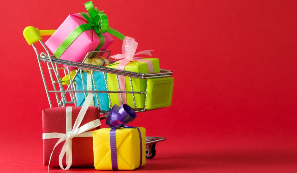 hopping cart with gifts and red background